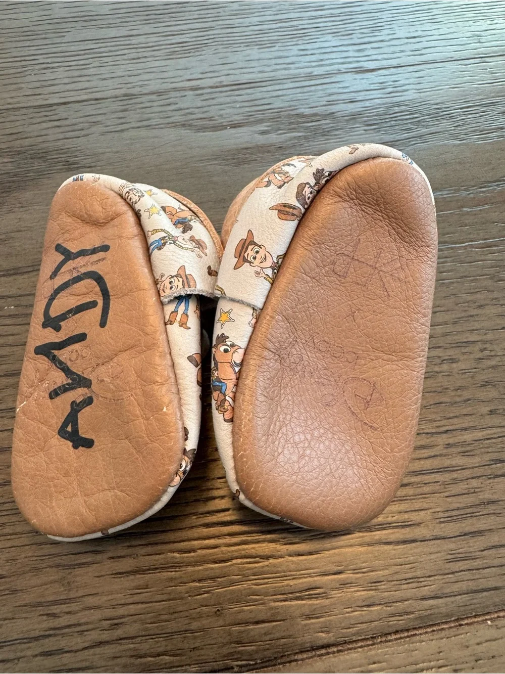 Freshly Picked Tan Moccasins with Cowboy Toy Story Print
